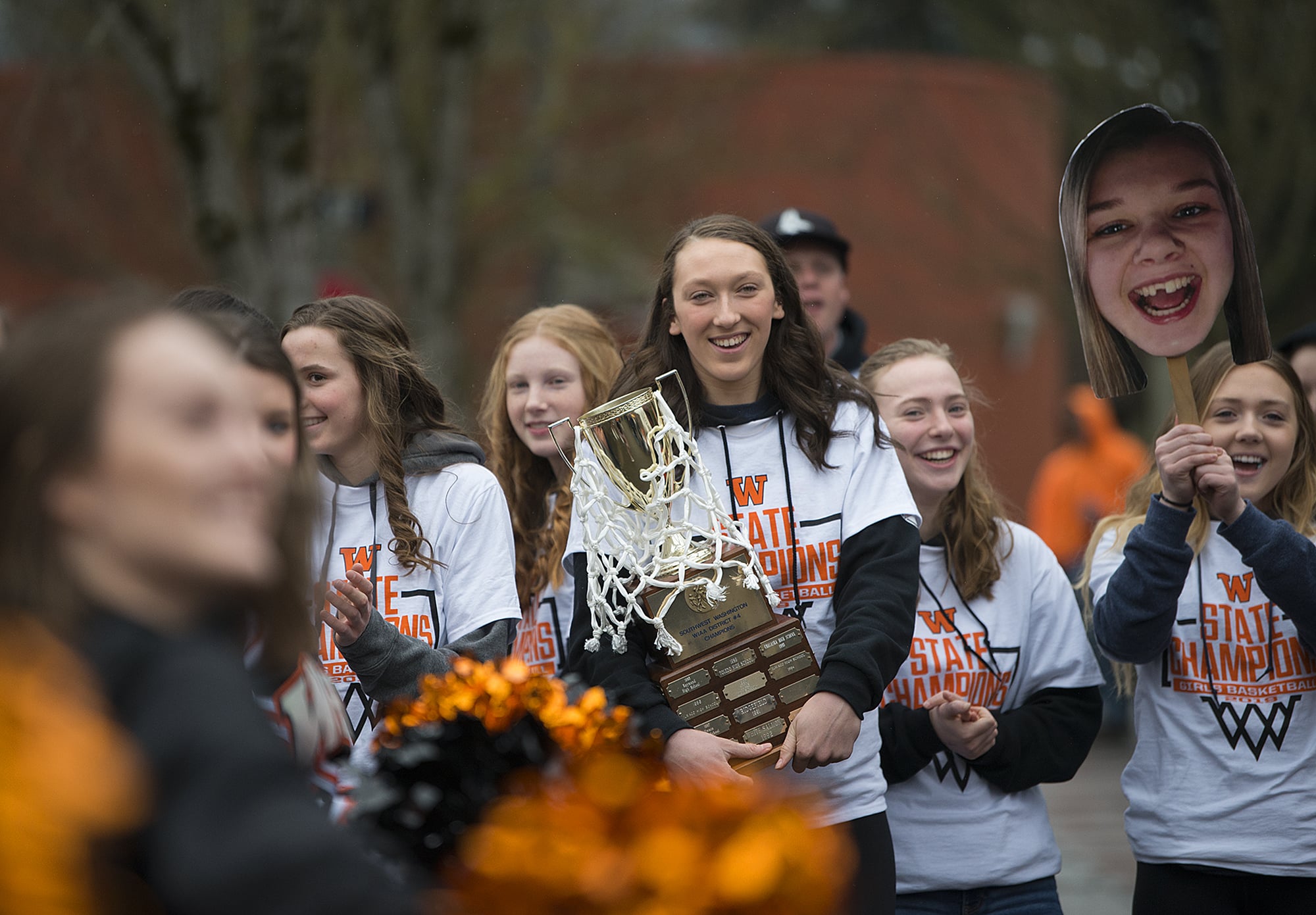 Washougal's Beyonce Bea, center, joins her teammates in celebrating the team's girls state basketball championship at Reflection Plaza in Washougal on Friday morning, March 8, 2019.