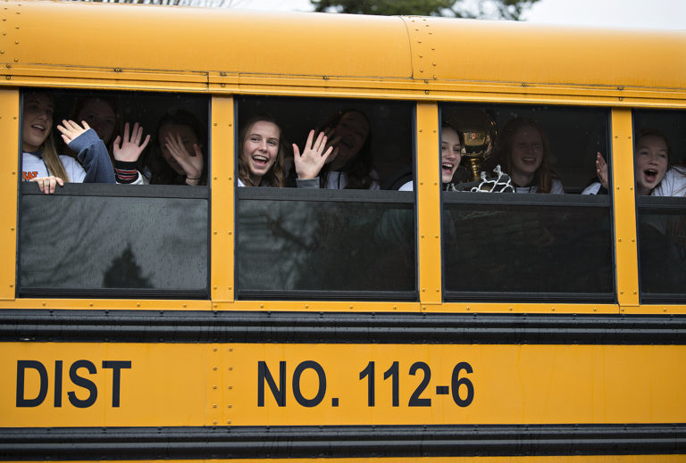 Members of the Washougal High School girls basketball team wave goodbye to fans as they leave Reflection Plaza after celebrating their first-ever championship title during a rally Friday morning, March 8, 2019.