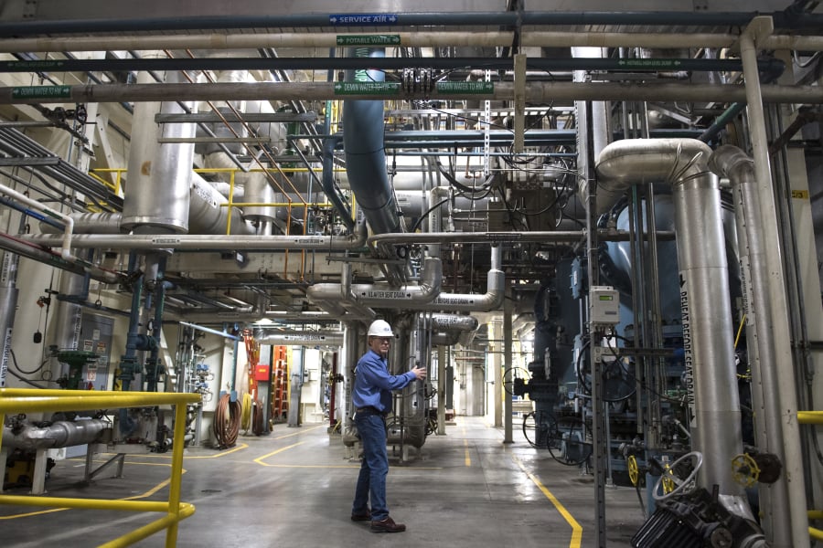 Terry Toland, an energy resource manager with Clark Public Utilities, leads a tour of the River Road Generation Plant. A bill in the Legislature exempts the plant from proposed green power requirements.