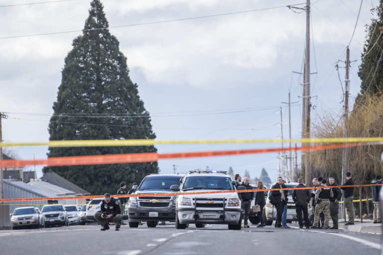 Vancouver Police officers and Clark County Sheriff's Deputies interact at the scene of a police shooting in Hazel Dell on Thursday, March 7, 2019.