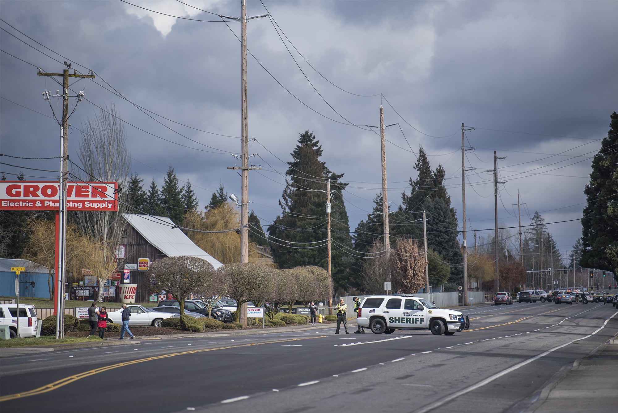 A Clark County Sheriff's cruiser blocks the road leading to the scene of a police shooting in Hazel Dell on Thursday, March 7, 2019.