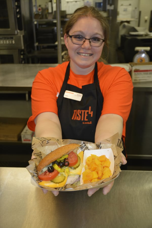 Washougal: Pam Spangenbert presents a sandwich courtesy of Taste4, a new lunch program from Sodexo being used at Washougal High School, which aims to give students more cafeteria options.
