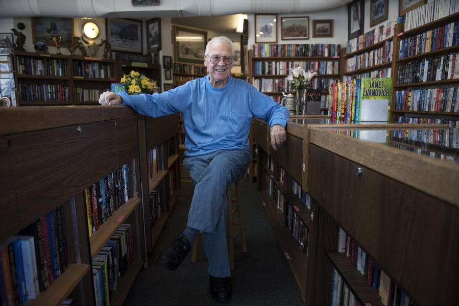 Owner Ron Pedersen sits inside the Hazel Dell Book Exchange. The store has been in operation for 44 years, and has survived retail headwinds by doubling as a vintage coin shop.