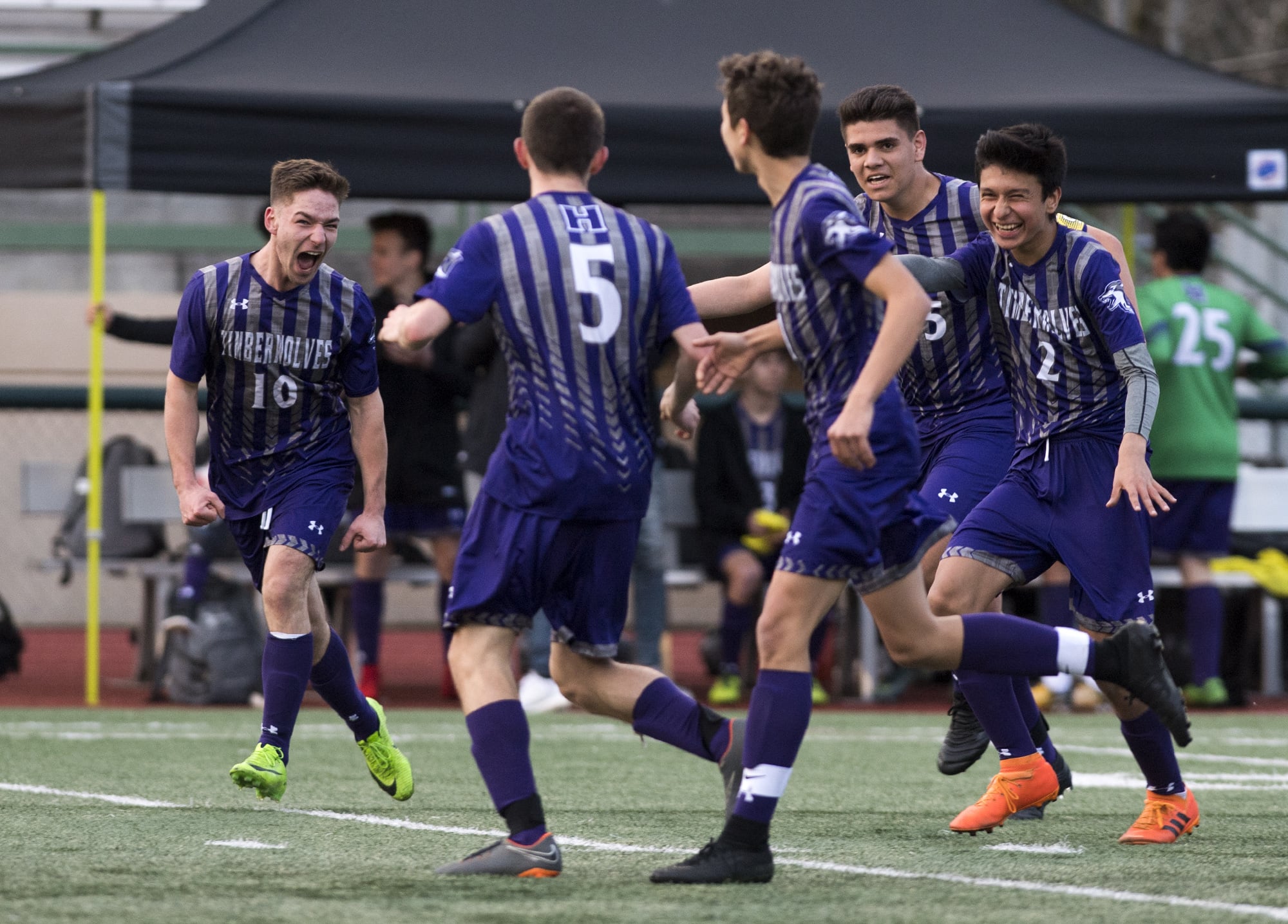 Heritage celebrates their first goal against Skyview during Tuesday night's soccer game at McKenzie Stadium in Vancouver on March 26, 2019.