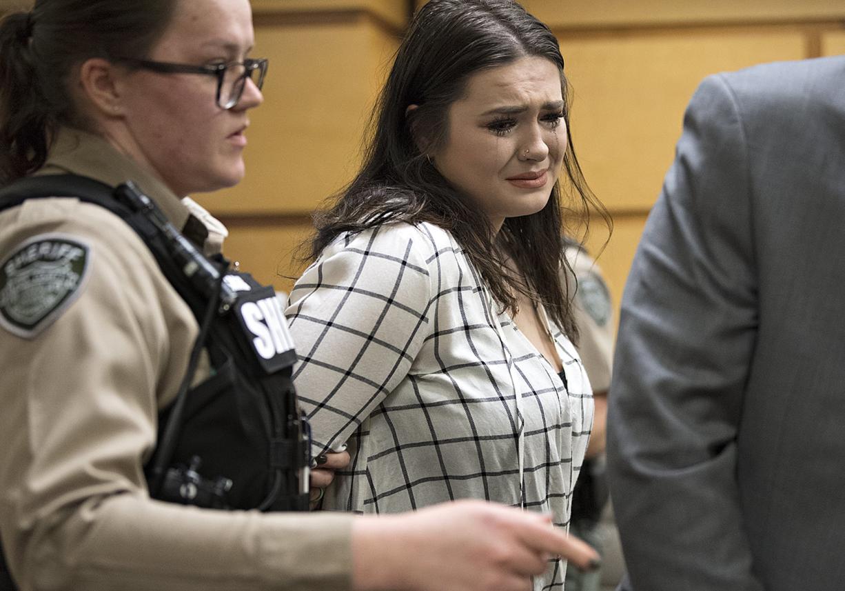 Tay'Lor Smith fights back tears as she is escorted out of the courtroom in handcuffs after being sentenced at the Clark County Courthouse on Wednesday afternoon, March 27, 2019. Smith pleaded guilty for pushing Jordan Holgerson of Kalama off the bridge at Moulton Falls Regional Park in August. She was sentenced to two days in jail and 38 days on a county work crew.