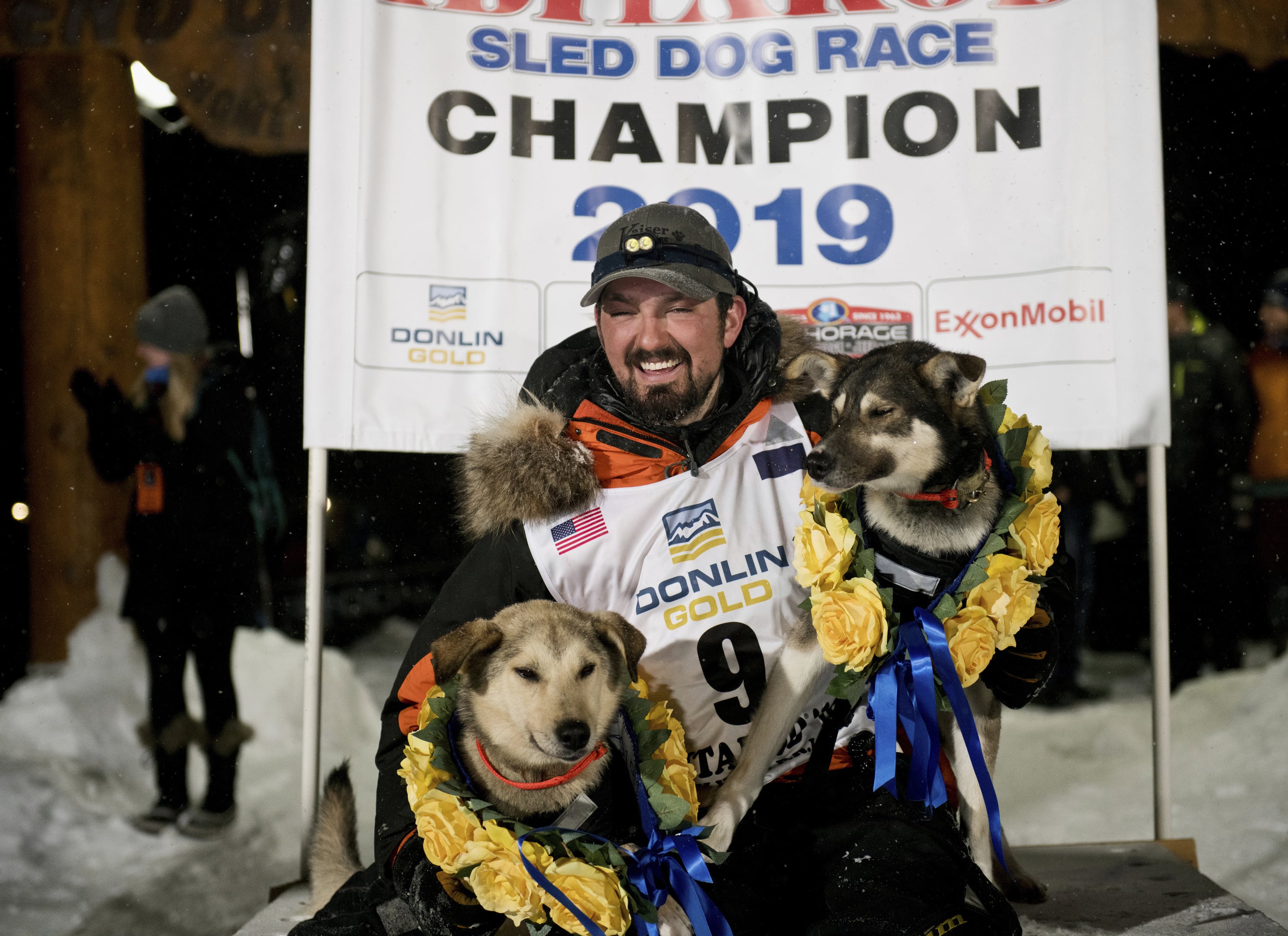 Peter Kaiser (9) poses with his lead dogs, Morrow, left, and Lucy., Wednesday, March 13, 2019, in Nome, Alaska, after winning the Iditarod Trail Sled Dog Race. It's the first Iditarod victory for Kaiser in his 10th attempt.