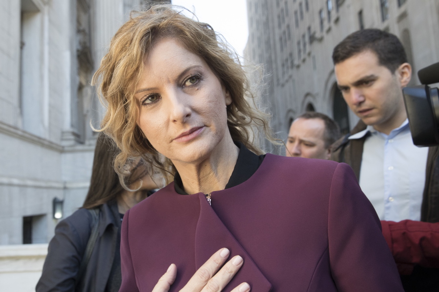 In this Oct. 18, 2018 file photo, Summer Zervos leaves New York state appellate court in New York. A New York appeals court has ruled that President Donald Trump isn’t immune from a defamation lawsuit filed by the former “Apprentice” contestant who accused him of unwanted kissing and groping.