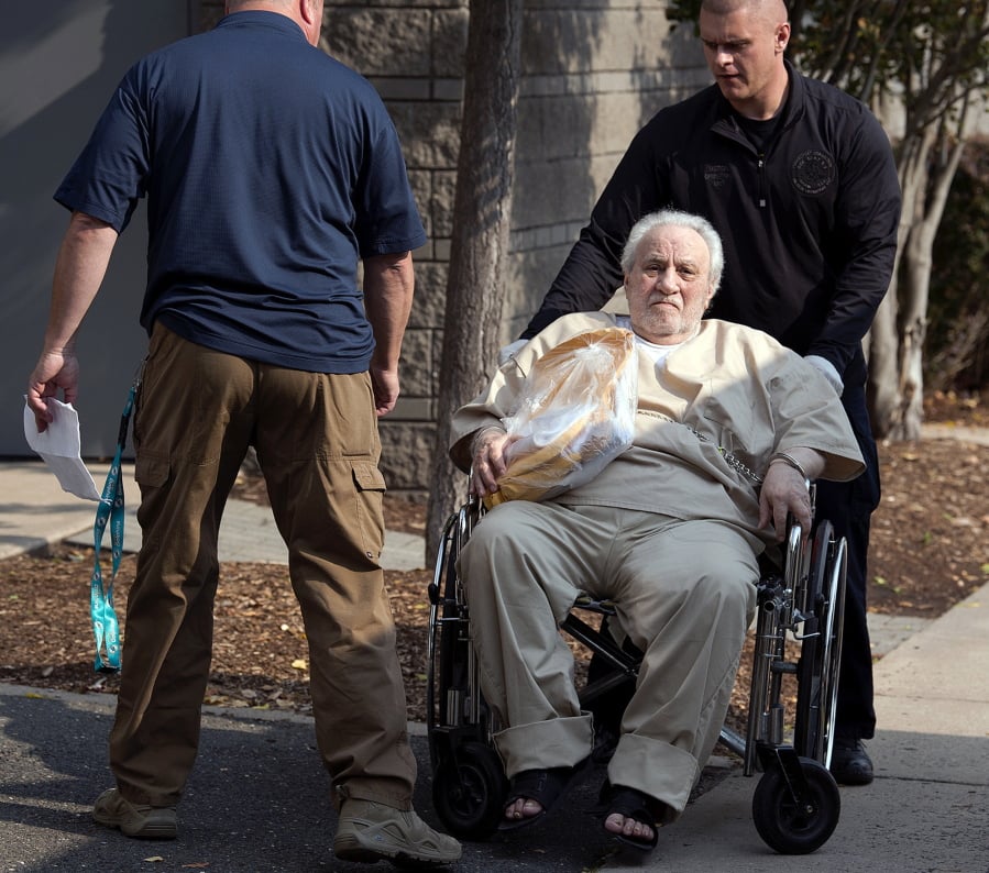 FILE - In this Sept. 5, 2017 file photo, Robert Gentile is wheeled into the federal courthouse in Hartford, Conn. The reputed Connecticut mobster, who authorities believe is the last surviving person of interest in the largest art heist in history, was released from prison Friday, March 15, 2018, in an unrelated weapons case. Federal prosecutors have said they think Gentile has information about the still-unsolved 1990 $500 million heist at the Isabella Stewart Gardner Museum in Boston.