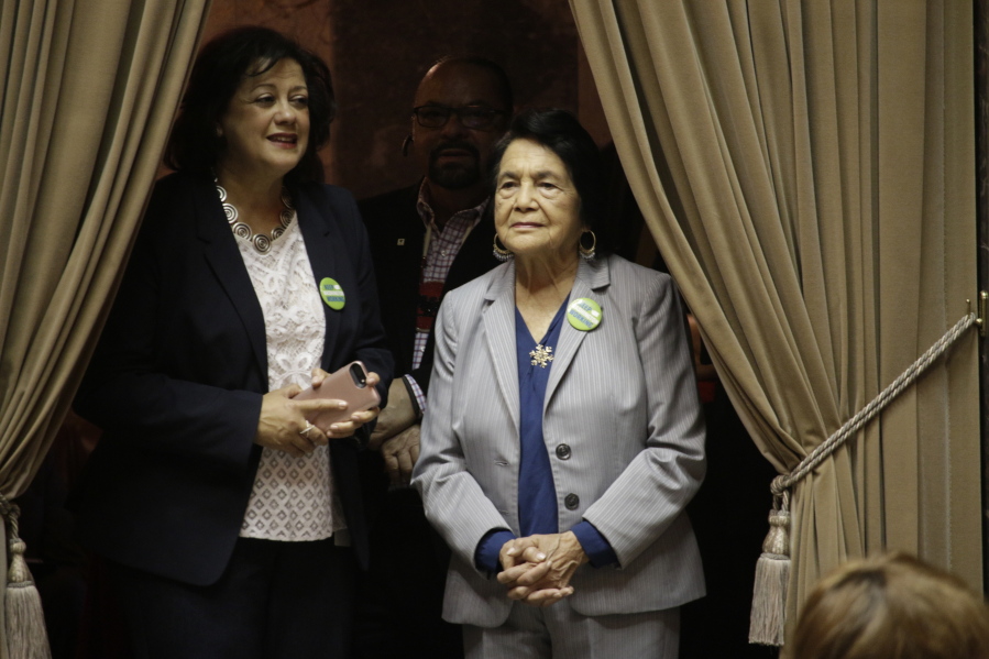 Dolores Huerta, right, watches as the Washington Senate discusses a measure to designate April 10 as “Dolores Huerta Day,” on Monday, March 18, 2019, in Olympia, Wash. The chamber unanimously passed the measure honoring Huerta, the Mexican-American social activist who formed a farmworkers union with Cesar Chavez.