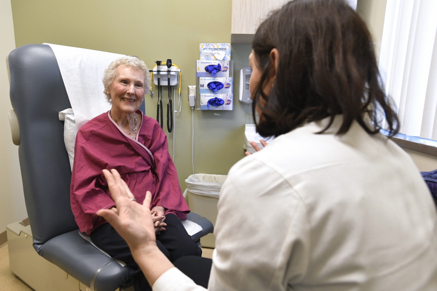 In this Monday, March 4, 2019, Nancy Simpson, left, speaks with Dr. Allison Magnuson, Geriatric Oncology and Breast Oncology at Wilmot Cancer Institute, at the Pluta Cancer Center in Rochester, N.Y. Simpson, 80, says she “wanted to do the maximum I could handle” to fight her disease.