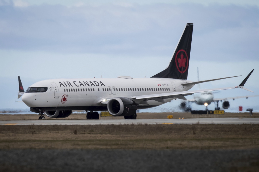 An Air Canada Boeing 737 MAX 8 aircraft departing for Calgary taxis to a runway at Vancouver International Airport in Richmond, British Columbia, on Tuesday.