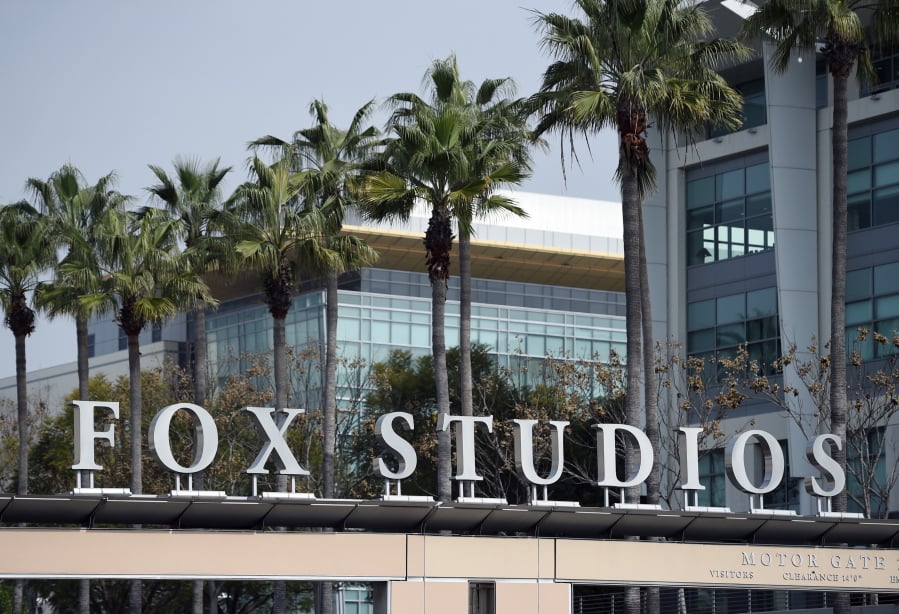 The Fox Studios sign is pictured at the entrance to the lot, Tuesday, March 19, 2019, in Los Angeles. Disney’s $71.3 billion acquisition of Fox’s entertainment assets is set to close around 12 a.m. EDT on Wednesday.