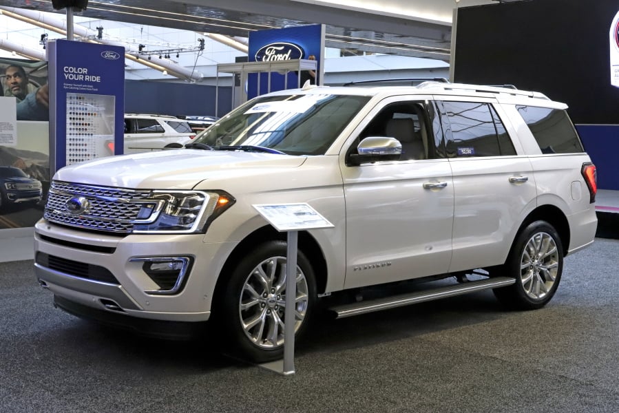 FILE- This Feb. 14, 2019, file photo shows a 2019 Ford Expedition 4x4 on display at the 2019 Pittsburgh International Auto Show in Pittsburgh. Ford Motor Co. said Tuesday, March 19, it will shift 550 jobs to its Kentucky Truck Plant to boost production of its Expedition and Lincoln Navigator to meet growing demand for its large SUVs. (AP Photo/Gene J.
