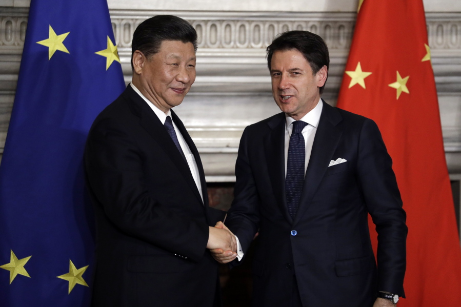 Chinese President Xi Jinping, left, and Italian Premier Giuseppe Conte shake their hands at the end of the signing ceremony of a memorandum of understanding at Rome’s Villa Madama, Saturday, March 23, 2019. Italy signed a memorandum of understanding with China on Saturday in support of Beijing’s “Belt and Road” initiative, which aims to weave a network of ports, bridges and power plants linking China with Africa, Europe and beyond.