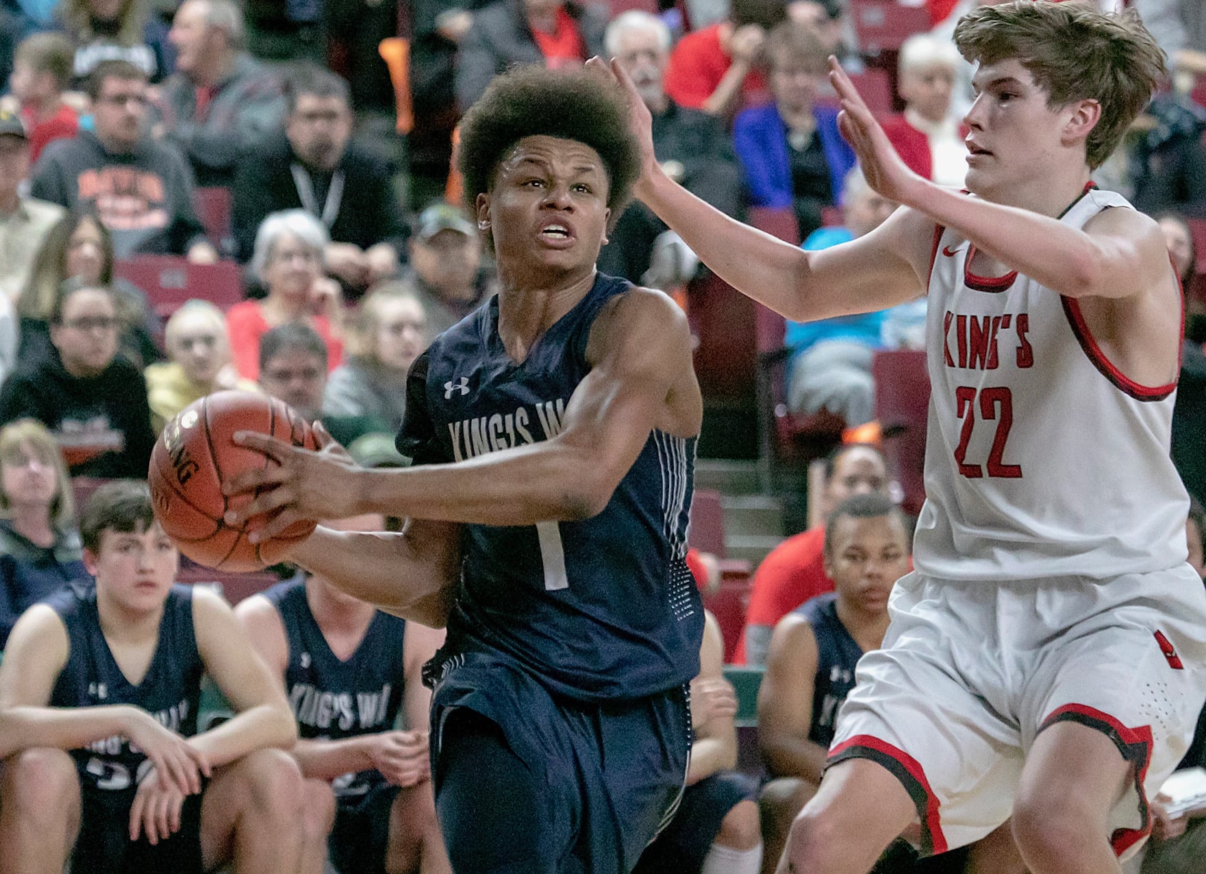 King's Way's Khalfani Cason (1), drives toward the hoop against King's Knights' Nate Kleppe (22), during the WIAA 1A boys state tournament on Friday, Mar. 1, 2019, at the Yakima Valley SunDome. King's Way Knights defeated King's Knights 43-42.