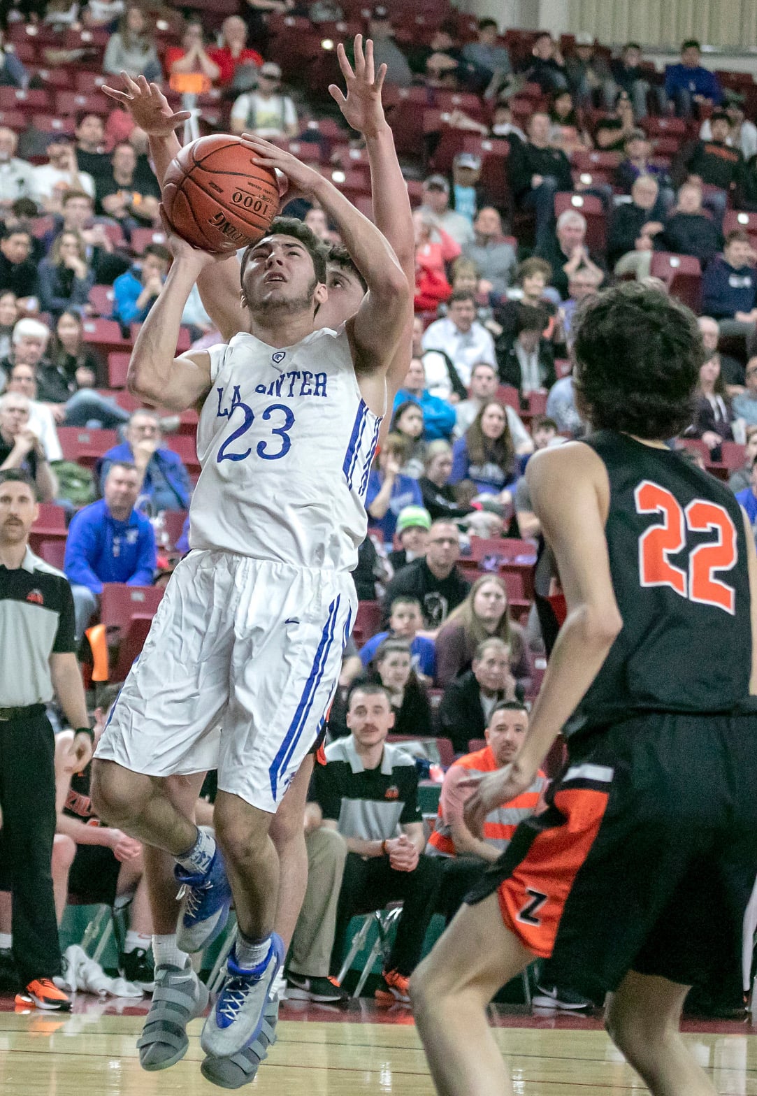 La Center's Hunter Ecklund (23), shoots Zillah's Kaden Magana (22), during the WIAA 1A boys state tournament on Friday, Mar. 1, 2019, at the Yakima Valley SunDome.