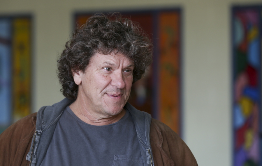 FILE - In this Wednesday, Oct. 14, 2015, file photo, Michael Lang speaks during a tour at the former Zena Elementary School in Woodstock, N.Y. Woodstock co-founder Michael Lang says the wait is almost over regarding performers for Woodstock 50, despite media reports claiming Jay-Z, Black Keys and others will perform at the event in August. The original Woodstock concert took place in 1969. On Thursday, March 7, 2019, Variety reported that Jay-Z, Black Keys, Dead & Company, Chance the Rapper, Imagine Dragons, the Killers, Gary Clark Jr.