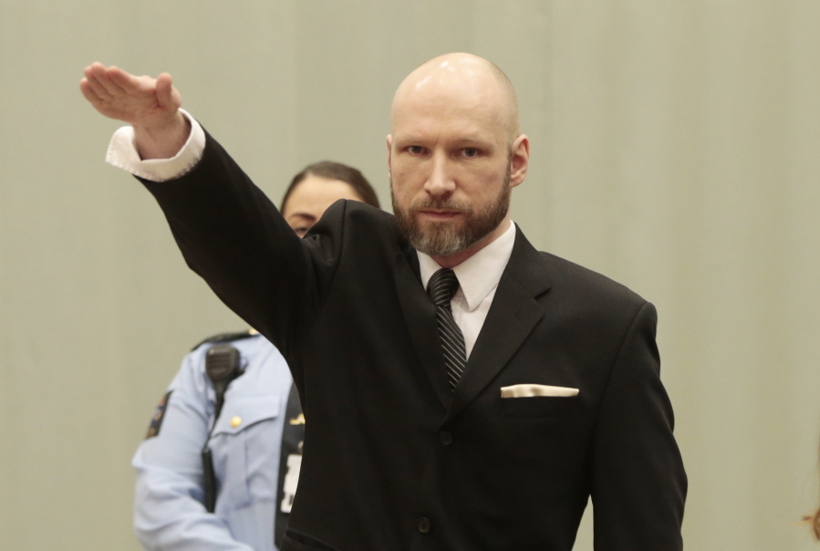 FILE - In this Tuesday, Jan. 10, 2017 file photo, Anders Behring Breivik raises his right hand at the start of his appeal case in Borgarting Court of Appeal at Telemark prison in Skien, Norway, Tuesday, Jan. 10, 2017. The manifesto that the presumed New Zealand shooter who killed at least 49 people in two mosques in Christchurch on Friday, March 15, 2019 published is shorter and “more sloppy” than the one written by a Norwegian right-wing extremist who killed 77 people in 2011, but expresses similar sentiments, a Swedish terror expert said.