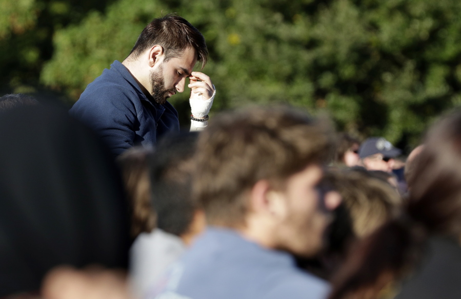 Mustafa Boztas, a survivor of March 15 mosque shootings attends a vigil in Hagley Park following the mass shooting in Christchurch, New Zealand, Sunday, March 24, 2019.