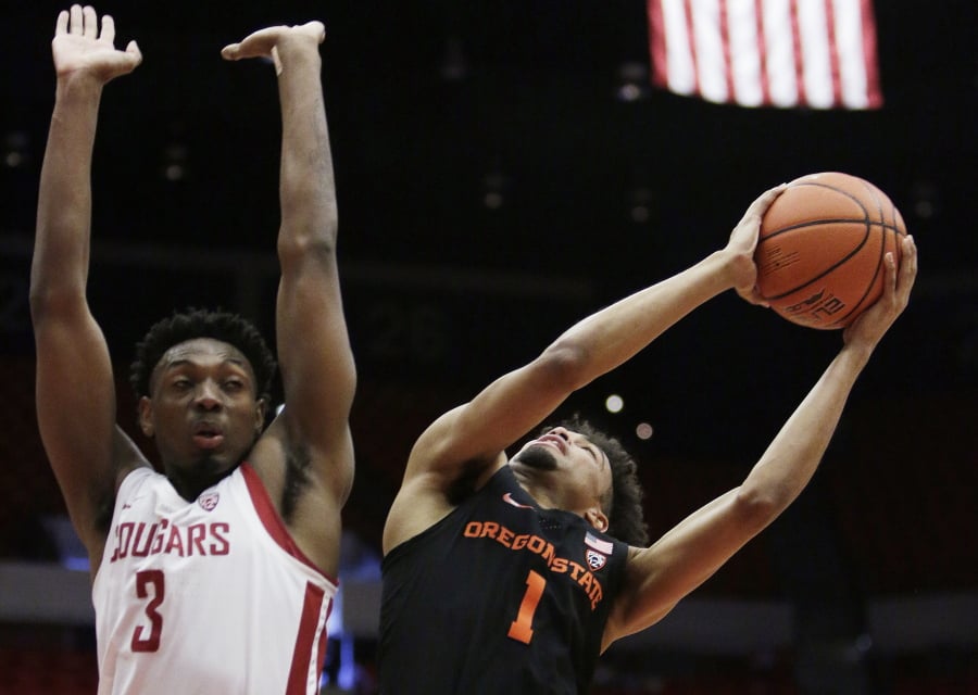 Oregon State guard Stephen Thompson Jr. (1) shoots while defended by Washington State forward Robert Franks Jr. (3) during the first half of an NCAA college basketball game in Pullman, Wash., Saturday, March 9, 2019.