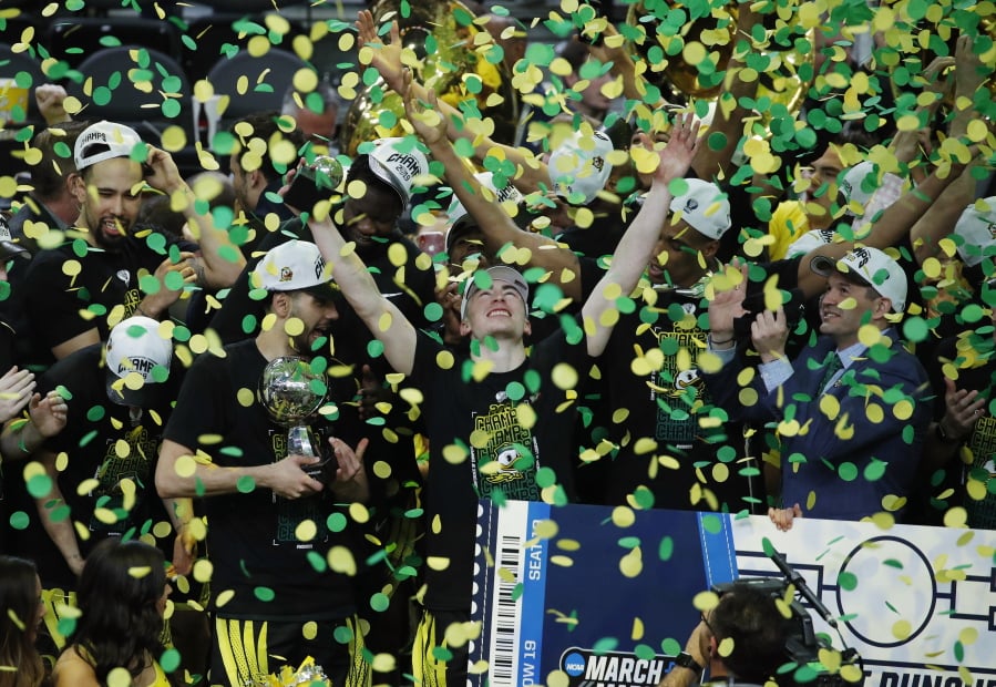 Oregon celebrates after defeating Washington 68-48 in an NCAA college basketball game in the final of the Pac-12 men’s tournament Saturday, March 16, 2019, in Las Vegas.