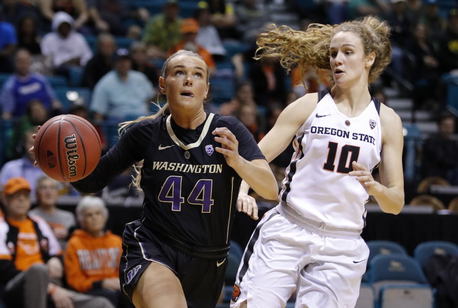 Washington’s Missy Peterson drives past Oregon State’s Katie McWilliams during the first half of an NCAA college basketball game at the Pac-12 women’s tournament Friday, March 8, 2019, in Las Vegas.
