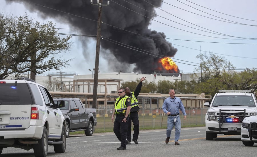 Smoke rises from a fire burning at the Intercontinental Terminals Company in Deer Park, east of Houston, Sunday, March 17, 2019. Some residents in the area are being urged to find a safe location indoors after the fire broke out at the petrochemicals terminal.