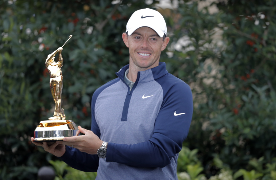 Rory McIlroy, of Northern Ireland, holds the trophy after winning The Players Championship golf tournament Sunday, March 17, 2019, in Ponte Vedra Beach, Fla.