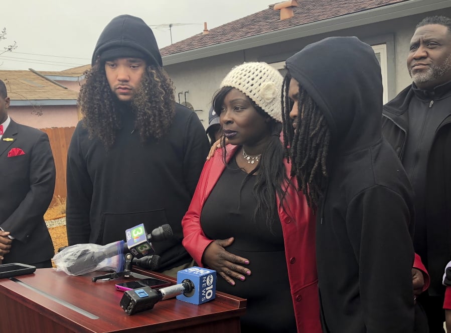Sequette Clark, center, the mother of police shooting victim Stephon Clark, discusses the decision not to prosecute the two Sacramento Police officers involved, during a news conference in Sacramento, Calif., Saturday, March 2, 2019. Sacramento County District Attorney Anne Marie Schubert said that Officers Terrance Mercadal and Jared Robinet did not break any laws when they shot Stephon Clark, 22, and no charges will be filed against them.