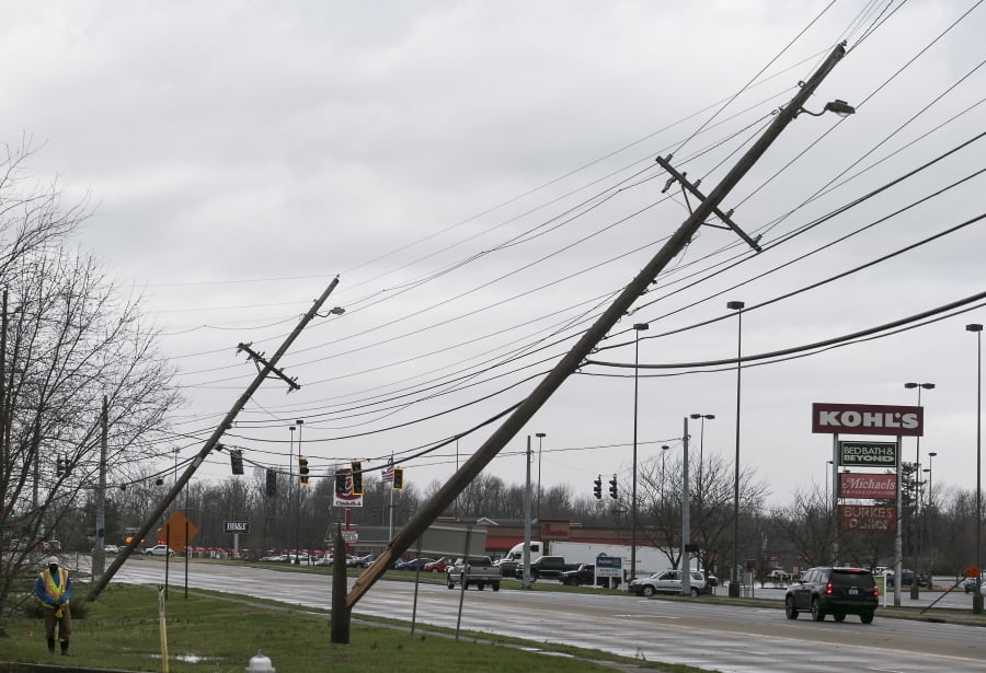 Power poles are broken Thursday after a tornado hit Paducah, Ky.