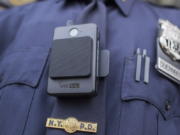 A police officer wears a newly-issued body camera outside in New York in 2017. Law enforcement and justice officials met last week to discuss the implementation of body-worn cameras in Clark County, and all agreed that now is the time to act.