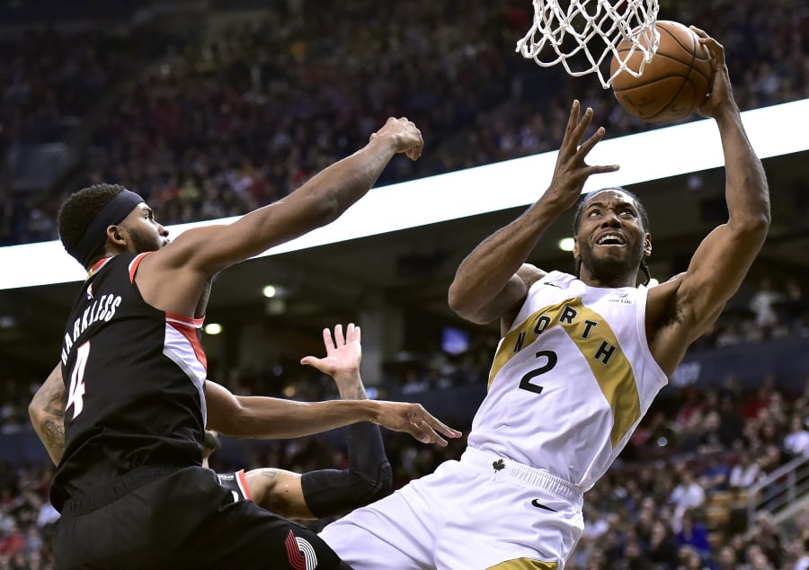 Toronto Raptors forward Kawhi Leonard (2) shoots as Portland Trail Blazers forward Maurice Harkless (4) defends during the second half of an NBA basketball game Friday, March 1, 2019, in Toronto.