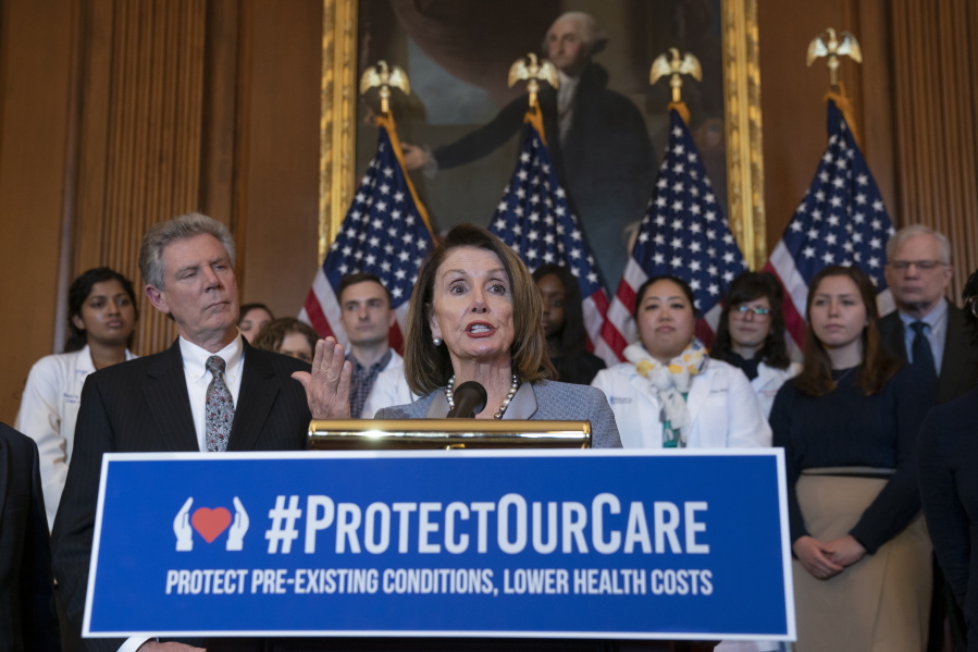 Speaker of the House Nancy Pelosi, D-Calif., joined at left by Energy and Commerce Committee Chair Frank Pallone, D-N.J., speaks at an event to announce legislation to lower health care costs and protect people with pre-existing medical conditions, at the Capitol in Washington, Tuesday, March 26, 2019. The Democratic action comes after the Trump administration told a federal appeals court that the entire Affordable Care Act, known as “Obamacare,” should be struck down as unconstitutional. (AP Photo/J.