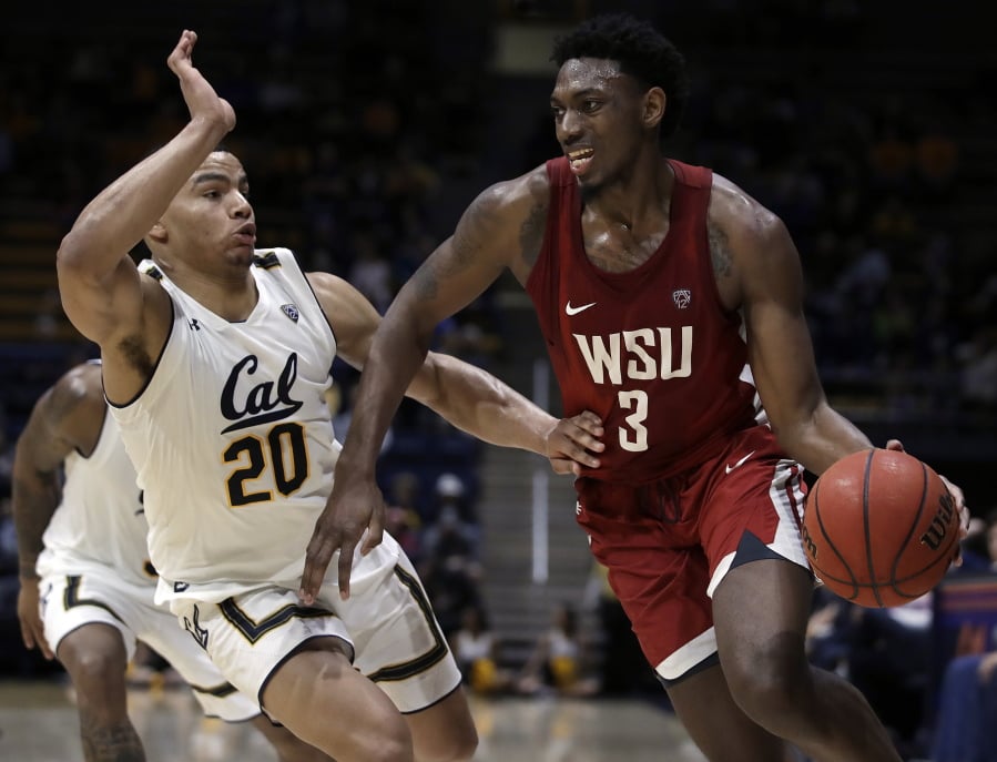 Washington State’s Robert Franks, right, drives the ball against California’s Matt Bradley (20) in the second half of an NCAA college basketball game Saturday, March 2, 2019, in Berkeley, Calif.
