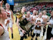 Washougal celebrates after winning the WIAA 2A girls state basketball championship over East Valley (Spokane), on Saturday, Mar. 2, 2019, at the Yakima Valley SunDome. Washougal Panthers defeated against the East Valley (Spokane) Knights in overtime 49-40.