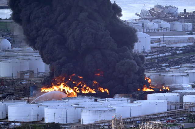 Firefighters battle a petrochemical fire at the Intercontinental Terminals Company Monday, March 18, 2019, in Deer Park, Texas. The large fire at a Houston-area petrochemicals terminal will likely burn for another two days, authorities said Monday, noting that air quality around the facility was testing within normal guidelines. (AP Photo/David J.