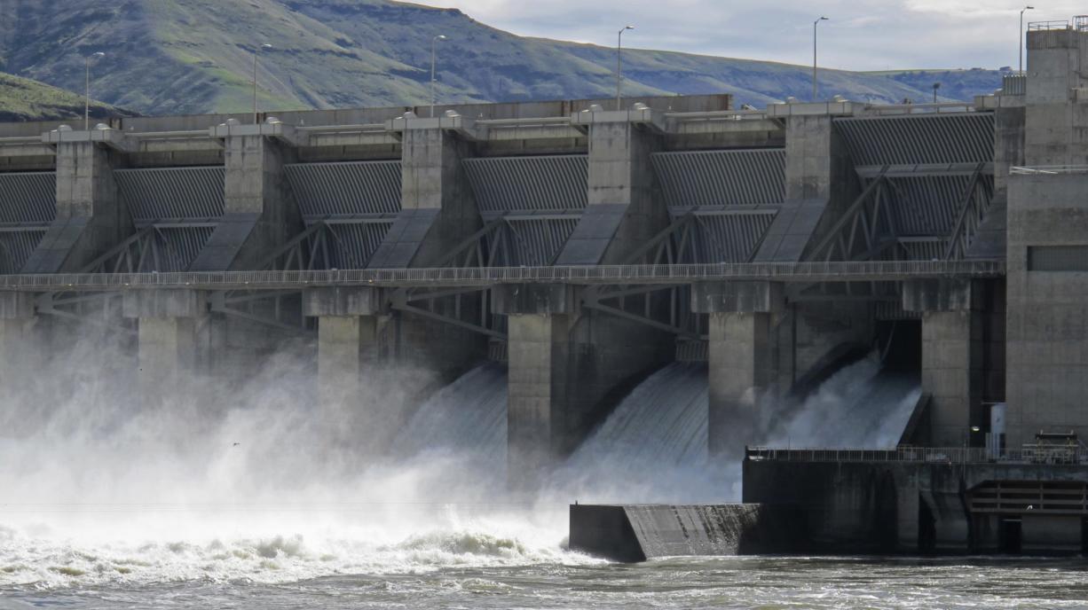 Water moves in April 2018 through a spillway of the Lower Granite Dam on the Snake River near Almota. A group of Washington utility districts, ports and business organizations are urging the state Senate to remove a $750,000 provision from its proposed state budget that would put together an advisory body to look at the question of breaching lower Snake River dams for the sake of salmon and orca.