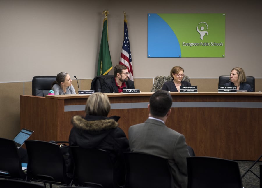 Members of the Evergreen School District Board of Directors Ginny Gronwoldt, from left, Rob Perkins, Victoria Bradford, and Julie Bocanegra meet for an emergency meeting at the Evergreen School District offices in Vancouver on Feb. 25, 2019.