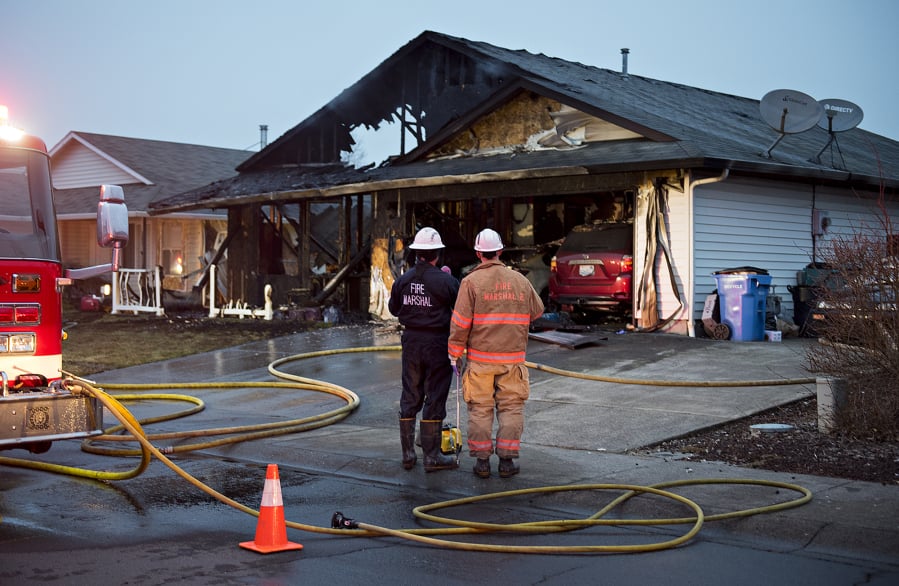 Officials investigate after a fast-moving fire destroyed a home March 6 in the Five Corners area of Vancouver. A relative said a family of six lost their home and their belongings in the blaze. The Clark County Fire Marshal’s Office has determined the fire started from damaged electrical wiring.