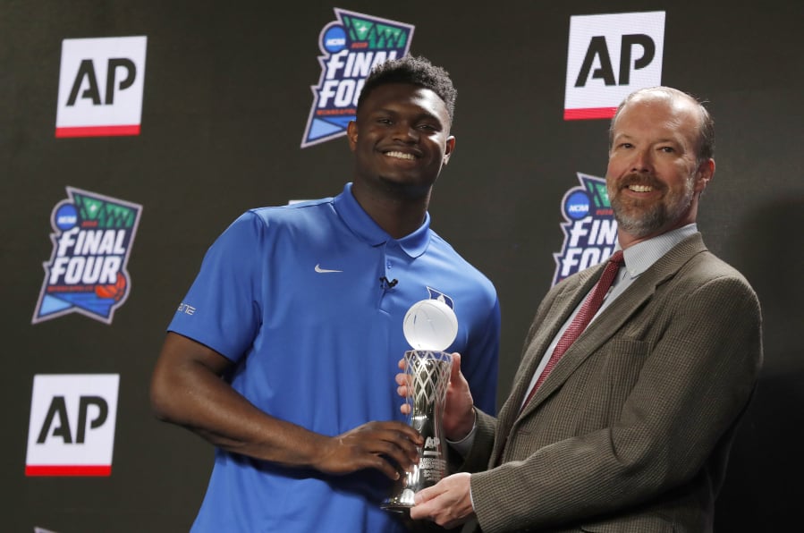 Duke freshman Zion Williamson, left, is presented The Associated Press College Basketball Coach of the Year Award, was named the John R. Wooden Women’s Player of the year at the College Basketball Awards ceremony in Los Angeles, Friday, April 12, 2019.