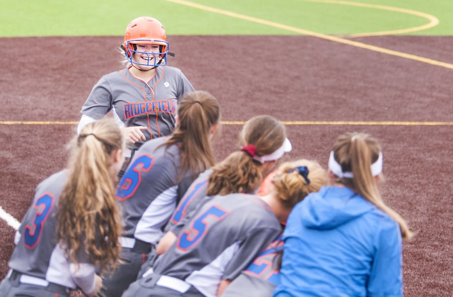 Ridgefield’s Emma Jenkins arrives at home plate after a two-run home run in the first inning against Hockinson.