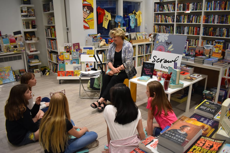 Author Barbara Carroll Roberts talks to kids in the Girl Power Book Club at Scrawl Books in Reston, Va., about her new book “Nikki on the Line.” Helen Roberts