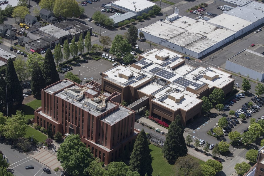 An aerial view of the Clark County Courthouse, front, and Clark County Jail behind it in downtown Vancouver.