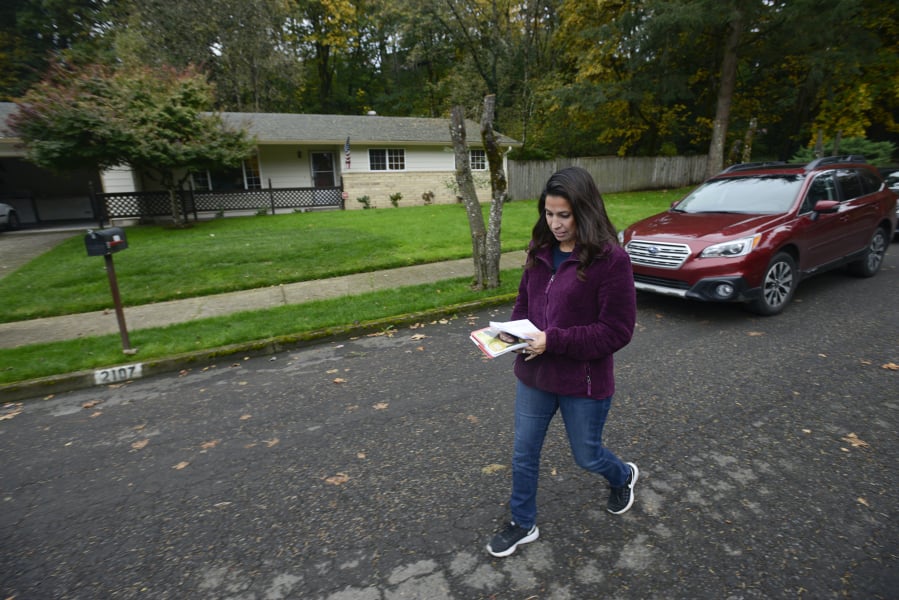 Candidate Monica Stonier walks a Vancouver neighborhood in October 2016, talking to residents about the upcoming election.