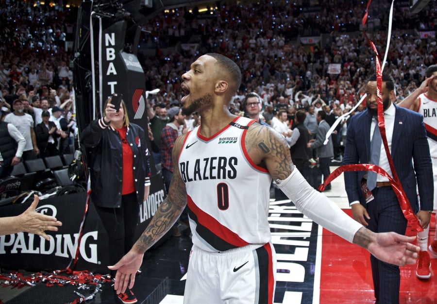 Portland Trail Blazers guard Damian Lillard celebrates after Game 5 of an NBA basketball first-round playoff series against the Oklahoma City Thunder, Tuesday, April 23, 2019, in Portland, Ore. The Trail Blazers won 118-115.
