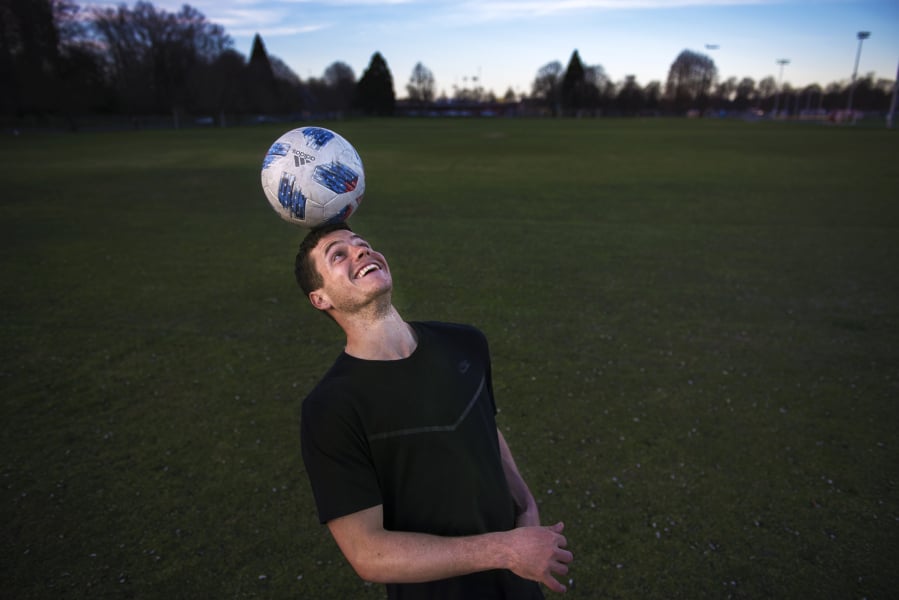 Foster Langsdorf heads the ball while posing for a press photo in Portland on Tuesday, March 19, 2019.