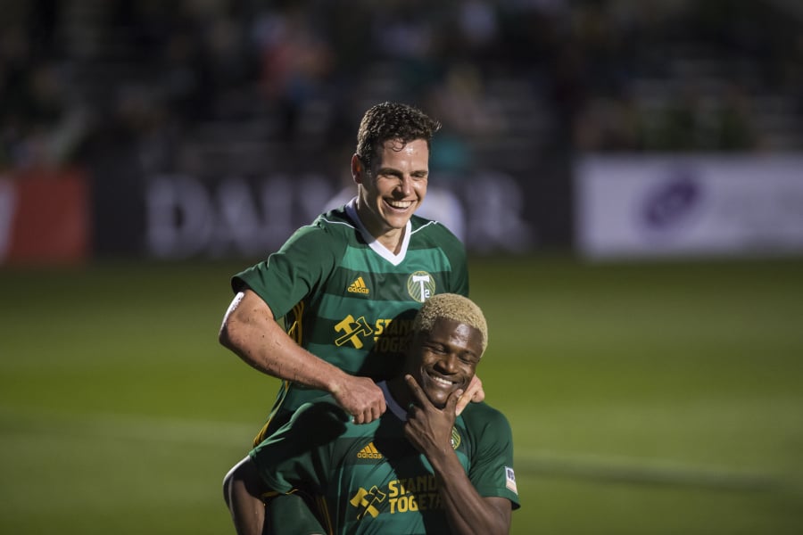 Foster Langsdorf jumps onto the back of teammate Dairon Asprilla in celebration of a goal scored by Asprilla during a T2 game against Las Vegas on Saturday, March 23, 2019.
