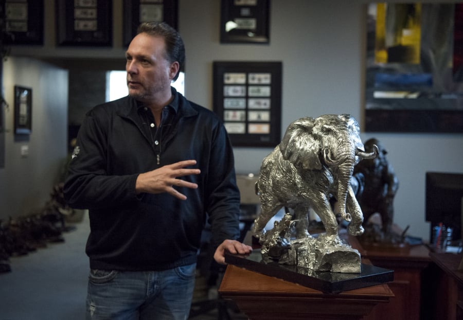 Founder Mark Russo describes one of Treasure Investments’ pieces made from silver at the company’s Battle Ground gallery. Most sculptures are cast from bronze, but the company can also produce works in silver and other precious metals.