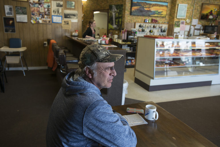 Vancouver resident Sam Rogers relaxes with a cup of coffee after finishing his doughnut at Donut Nook. Rogers lives in the neighborhood and stops by for a cup of coffee and a doughnut as often as he can during his regular walks.