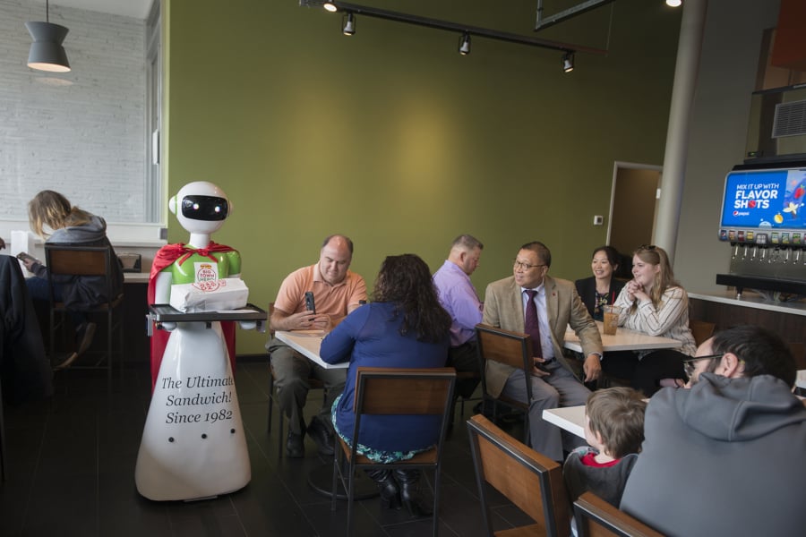 A robot delivers the lunch order for a customer at the new Big Town Hero in downtown Vancouver. The sandwich shop, which opened Thursday, is one of 14 locations in Oregon and Washington.